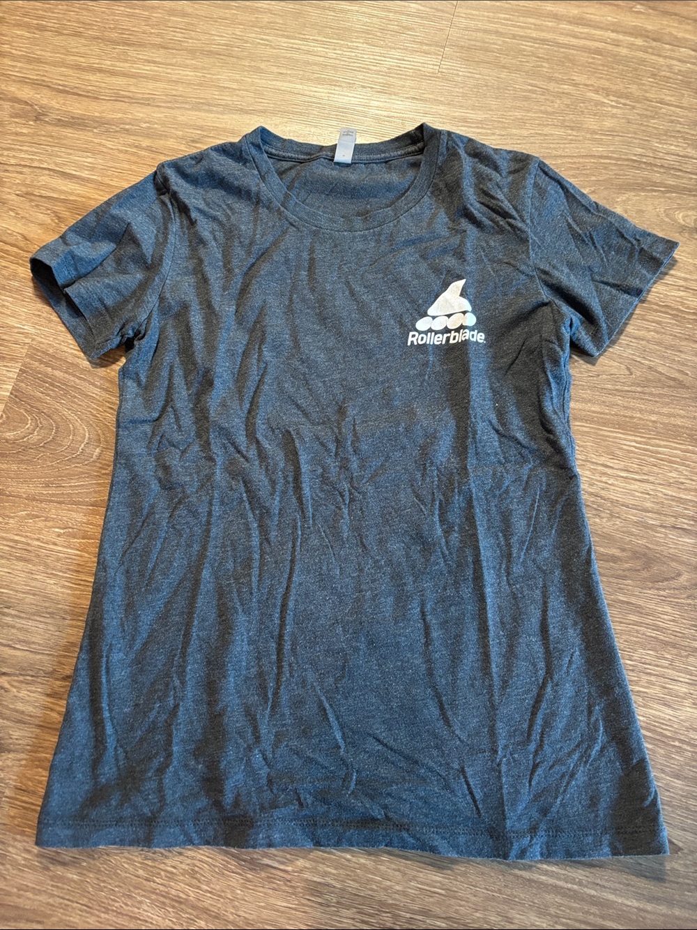 Next Level Apparel Women's Black Tee with White Rollerblade Chest Logo